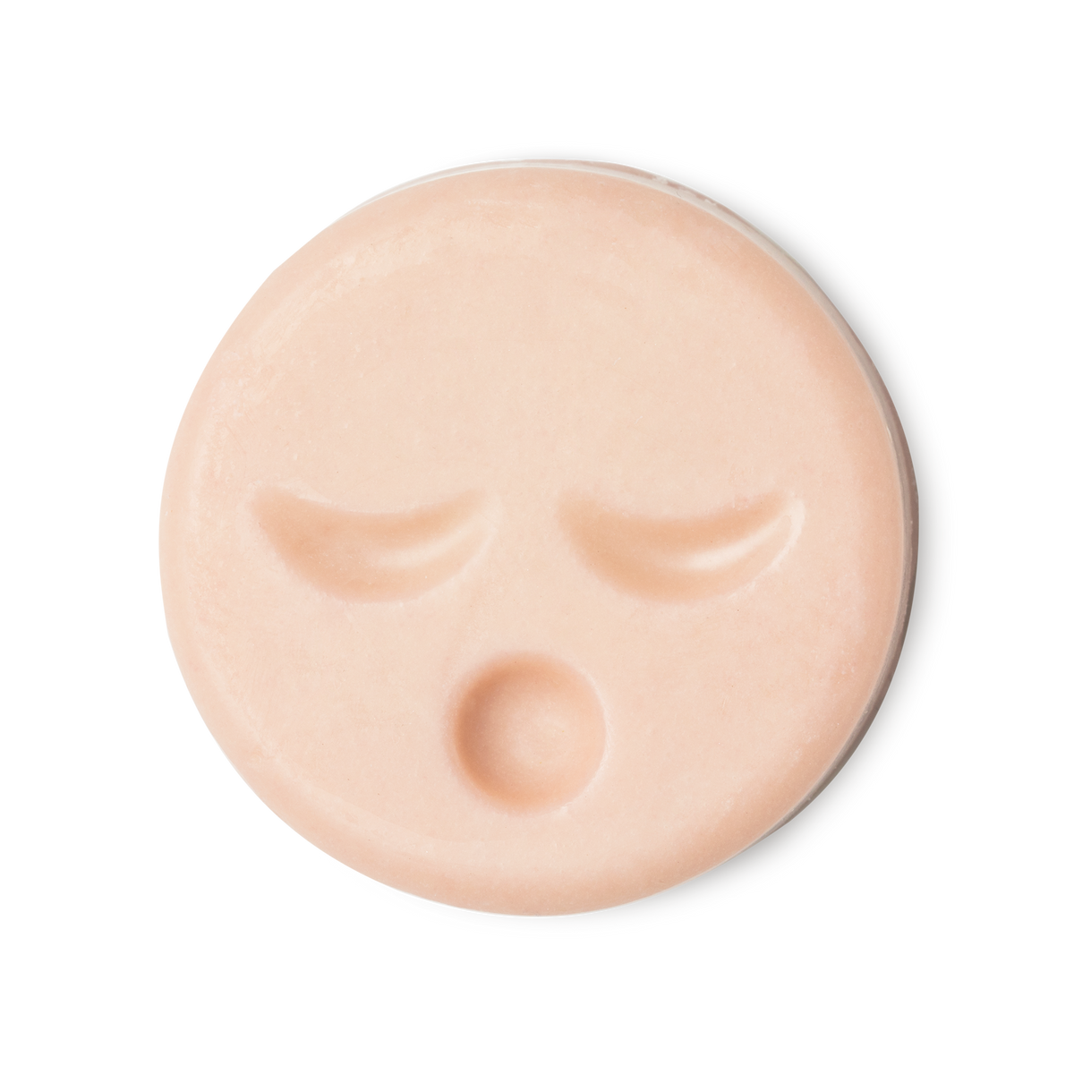 Sleepy Face. A circular, pale peachy pink naked cleansing balm, engraved with little yawning face.